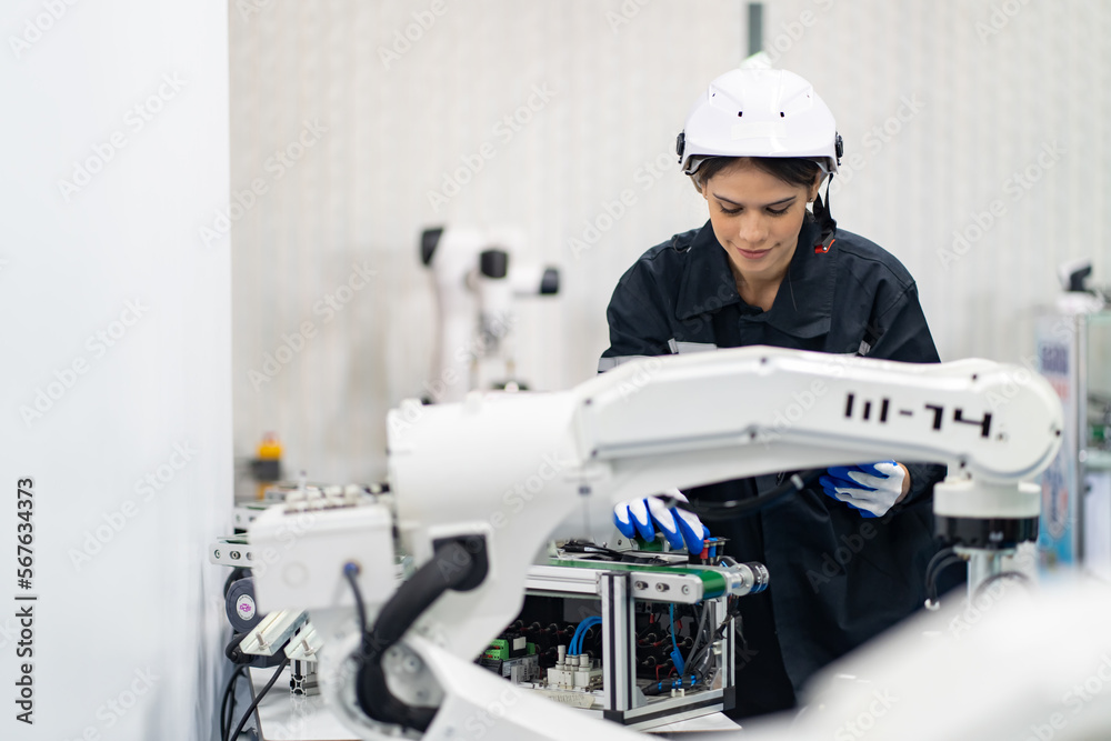 Engineer check and control welding robotics automatic arms machine in intelligent factory automotive industrial with monitoring system software. Digital manufacturing operation. Industry 4.0 Engineer check and control welding robotics automatic arms machine in intelligent factory automotive industrial with monitoring system software. Digital manufacturing operation. Industry 4.0