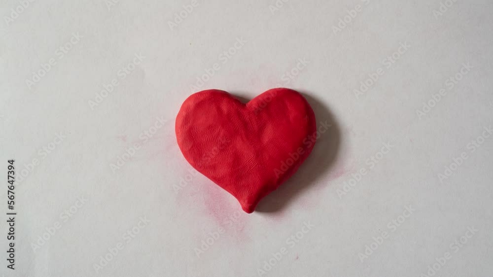 Stop motion of heart shape made from clay Stop motion of heart shape made from clay
