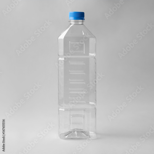 Mockup PET Plastic Clean Disposable Bottle, Mock Up Template. Isolated On grey Background. Ready For Your Design. Product Packaging.