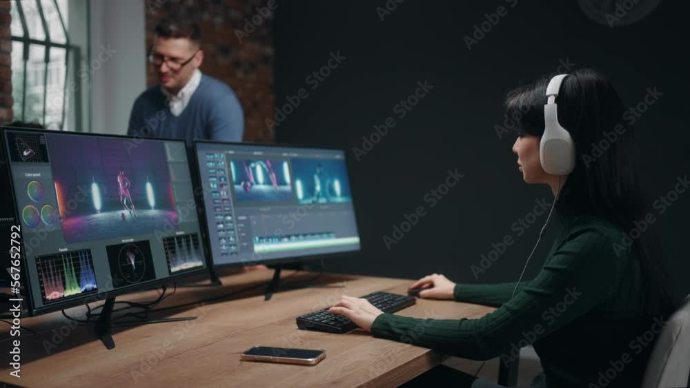 young woman professional video editor making final cut of musical clip, montage and color grading