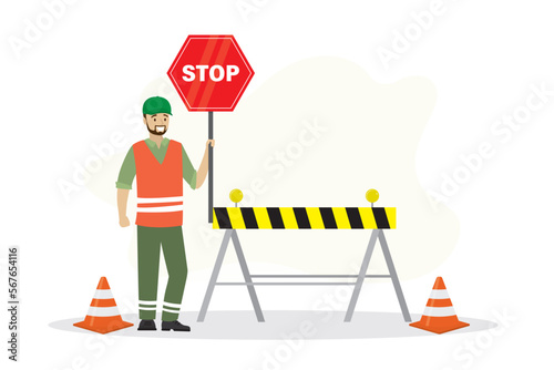 Worker man in uniform holds warning sign, construction area. Way and passage is closed, red sign is stop. Traffic cones and barrier. Repair work on road. Site under construction.