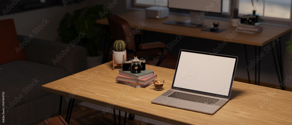Laptop white screen mockup with camera, coffee cup, book and decor plant on wood table Laptop white screen mockup with camera, coffee cup, book and decor plant on wood table