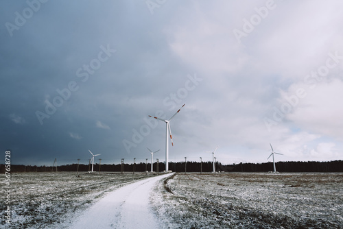 Obraz na płótnie windmill farm or wind park, with high wind turbines for generation electricity. w salonie