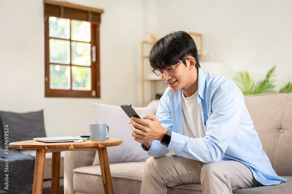 Businessman in casual is sitting on comfortable sofa and chattin Businessman in casual is sitting on comfortable sofa and chattin