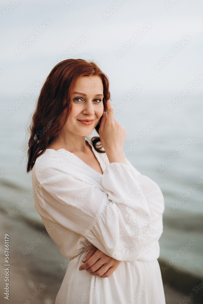 pregnant girl with brown hair on the seashore pregnant girl with brown hair on the seashore