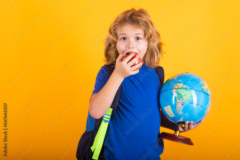 School boy world globe and apple. School and kids. Cute blonde child with a book learning. Knowledge day. School boy world globe and apple. School and kids. Cute blonde child with a book learning. Knowledge day.