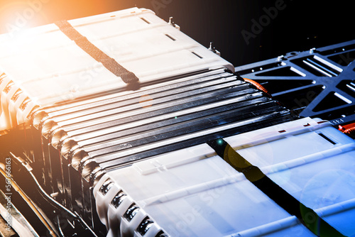 A group of lithium-ion cells of an electric car battery with elements of a heating system that prevents the battery from overcooling in winter. Artistic flare and toning effects