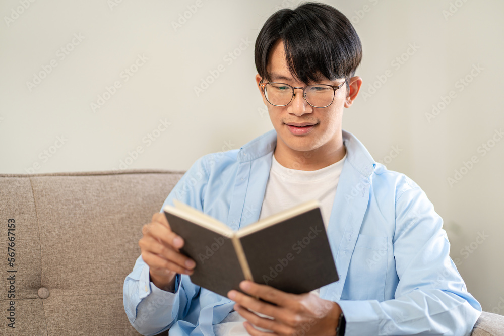 Businessman in casual is sitting on comfortable sofa to relaxati Businessman in casual is sitting on comfortable sofa to relaxati