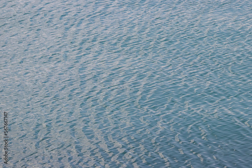 water texture sea waves and ripples pattern. Calm blue nature background