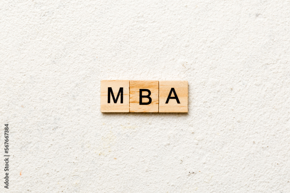 MBA word written on wood block. Master of Business Administration text on table, concept MBA word written on wood block. Master of Business Administration text on table, concept
