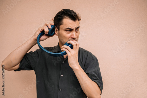 Adult male listening to loud music