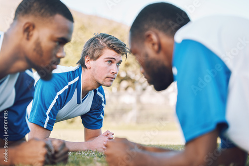 Team, push up and football player coaching on field training, practice and sports challenge with muscle support. Group, soccer people or men on grass or ground for workout fitness of personal trainer