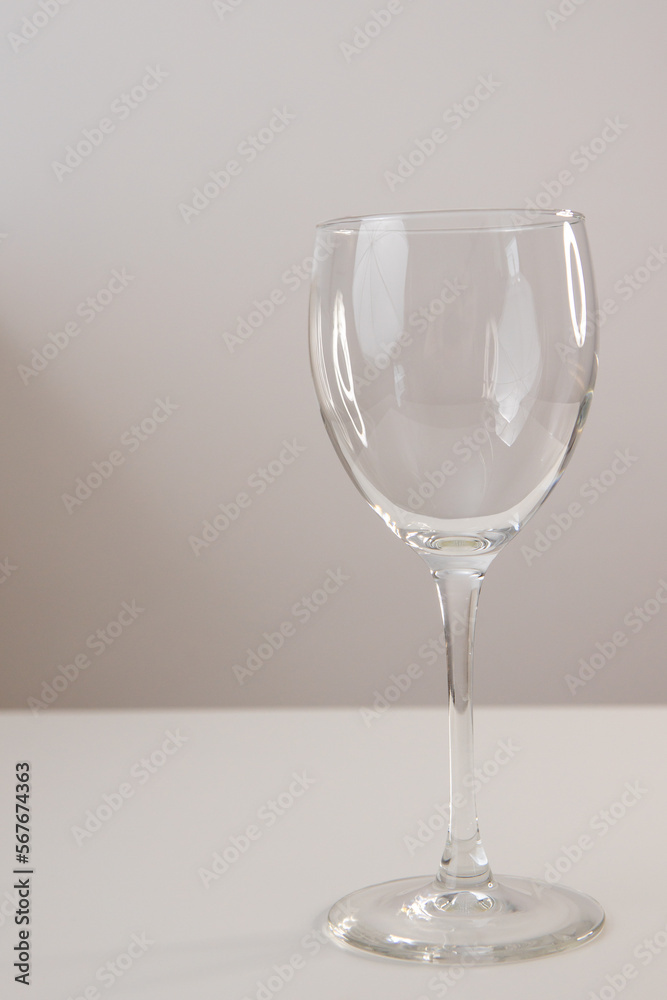 transparent wine glass on a light background transparent wine glass on a light background