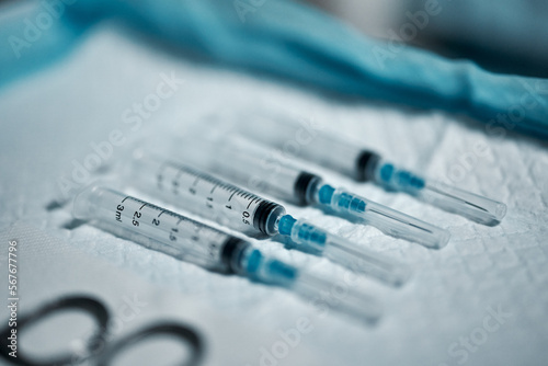 Needle syringe, healthcare tools and surgery, medicine and medical tray with drugs, procedure and anesthesia closeup. Vaccine, health equipment and hospital with injection, science and medication