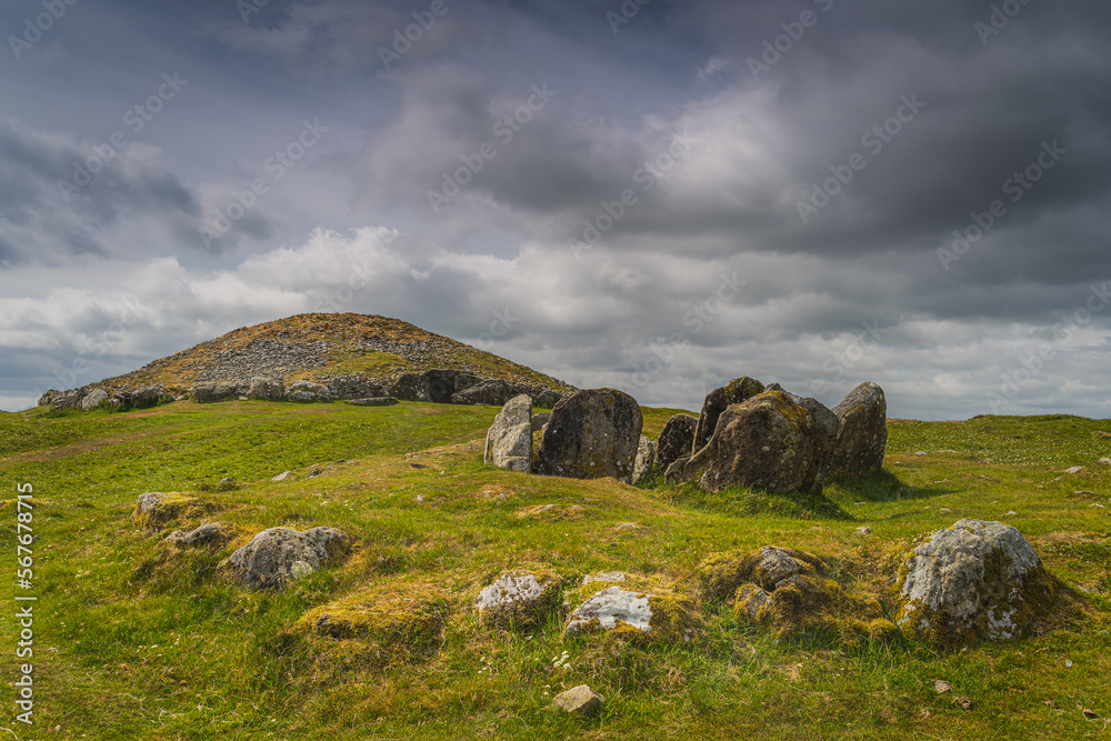 Ancient, dating back to 3000 BCE, neolithic burial chambers and stone circles of Loughcrew Cairns with dramatic, dark sky in County Meath, Ireland Ancient, dating back to 3000 BCE, neolithic burial chambers and stone circles of Loughcrew Cairns with dramatic, dark sky in County Meath, Ireland
