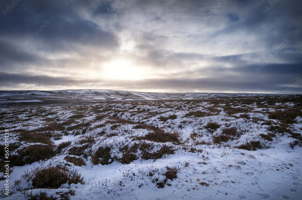 The frozen snow covered hills, countryside at sunrise of Muggleswick and Edmondbyers common, moor in winter near Blanchland, Northumberland  in England UK.