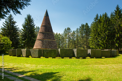 Monument in the city of Berane in Montenegro. Monument in the form of a cone. Unusual architecture. Solar field. Historical place. photo