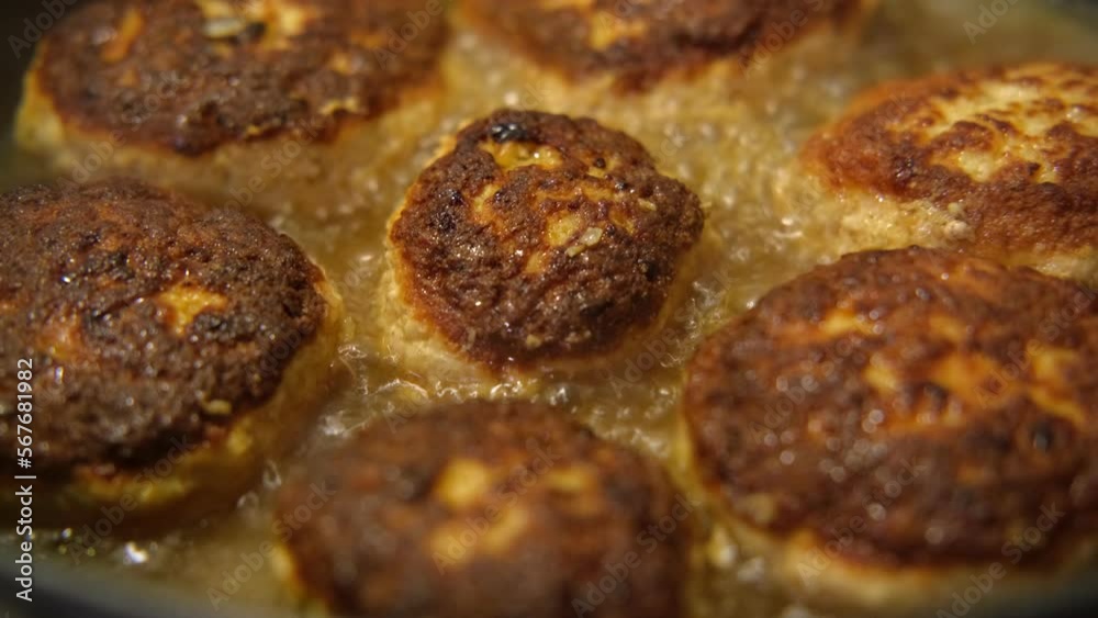 Fried cutlets from minced meat in frying pan. Preparing Meatballs in a Pan. Beef, Pork roasted steakes ready for eat. Frying Juicy delicious Homemade beef meatballs in cast-iron skillet. Close Up. Fried cutlets from minced meat in frying pan. Preparing Meatballs in a Pan. Beef, Pork roasted steakes ready for eat. Frying Juicy delicious Homemade beef meatballs in cast-iron skillet. Close Up.