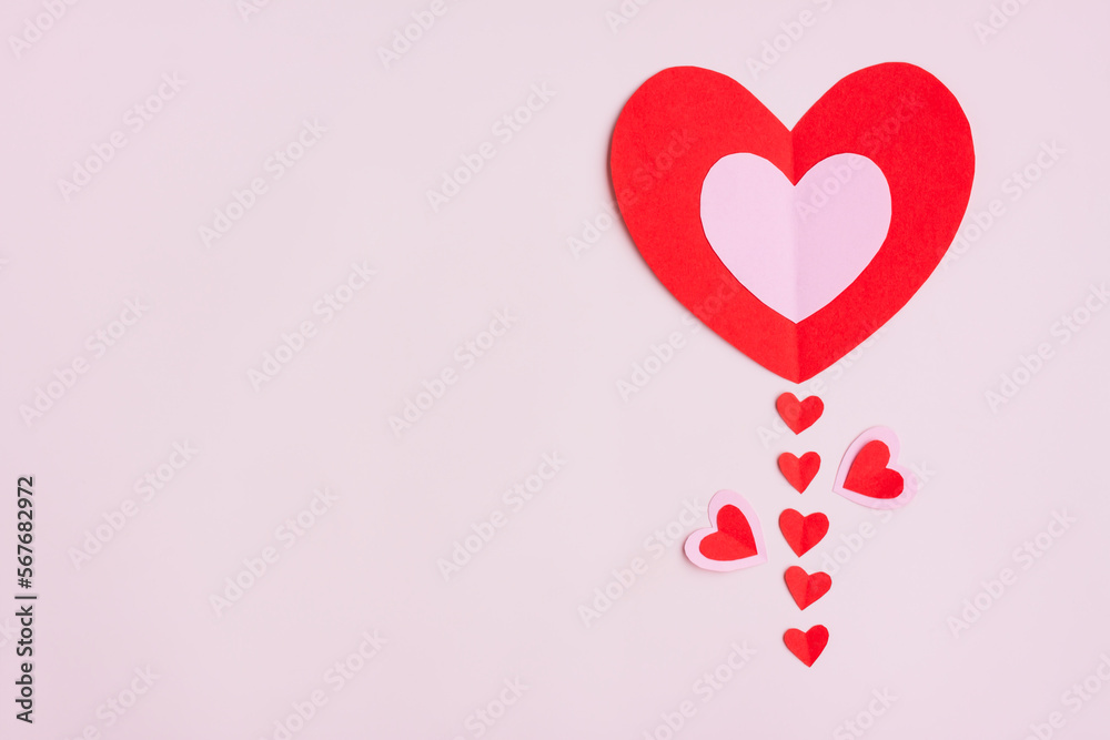 Red and Pink Paper Hearts on pink background, Heart shape papercut, Flower shaped, Happy Valentine's day