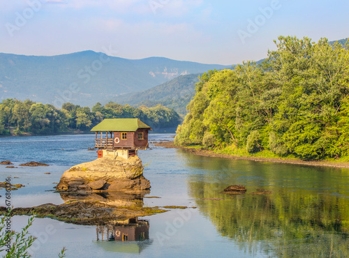 Small house on a stone on Drina river, near the Bajina Basta in Serbia photo