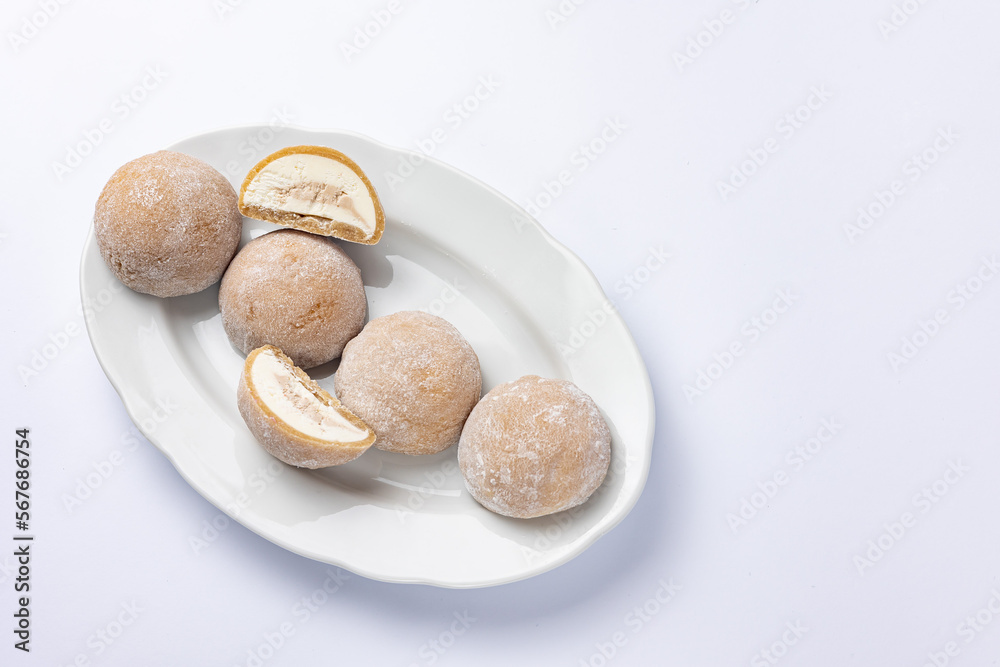 Delicious mochi on a white background, close-up. Traditional Japanese dessert
Delicious mochi on a white background, close-up. Traditional Japanese dessert