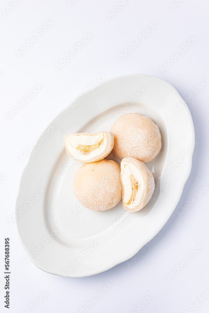 Delicious mochi on a white background, close-up. Traditional Japanese dessert
Delicious mochi on a white background, close-up. Traditional Japanese dessert