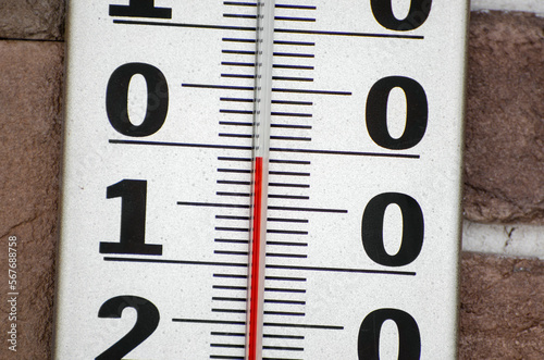 Close-up white plastic thermometer scale. Minus 1 degrees Celsius. Weather forecast. photo