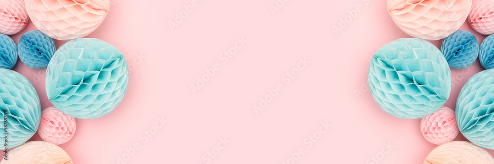Banner with frame made of tissue paper balls different sizes in a blue and pink colors. Place for your design. Banner with frame made of tissue paper balls different sizes in a blue and pink colors. Place for your design.