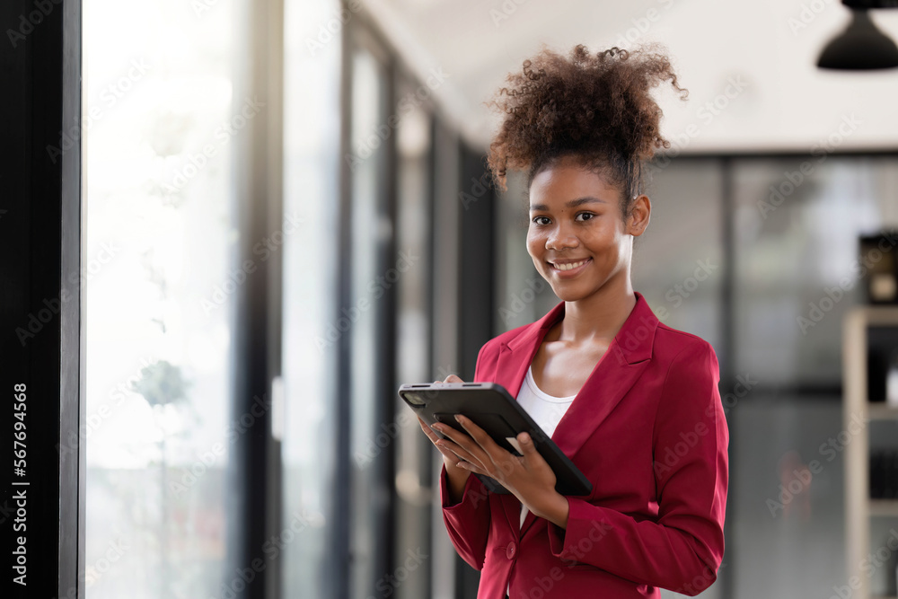 Woman on workplace taking information from digital tablet Woman on workplace taking information from digital tablet