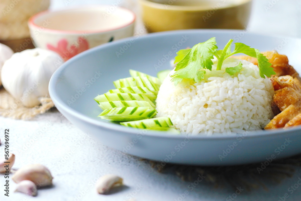 Thai style grilled chicken with rice and spicy soup on white background Thai style grilled chicken with rice and spicy soup on white background