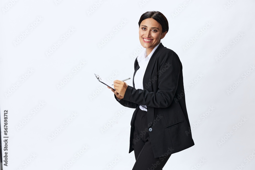 Business woman folder with documents in black business suit shows signals gestures and emotions on white background, freelancer job online time management Business woman folder with documents in black business suit shows signals gestures and emotions on white background, freelancer job online time management