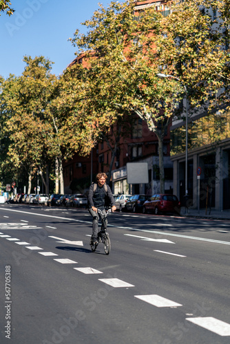 Man Riding Bike in Street © santypan
