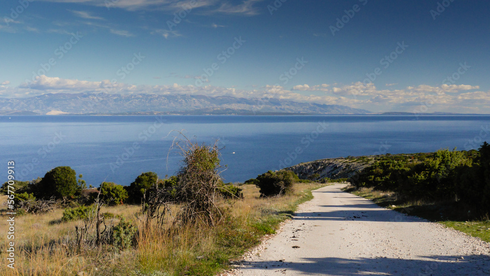 View over path towards ornithological station and mediterranean sea on Island Cres, Dalmatia, Croatia
