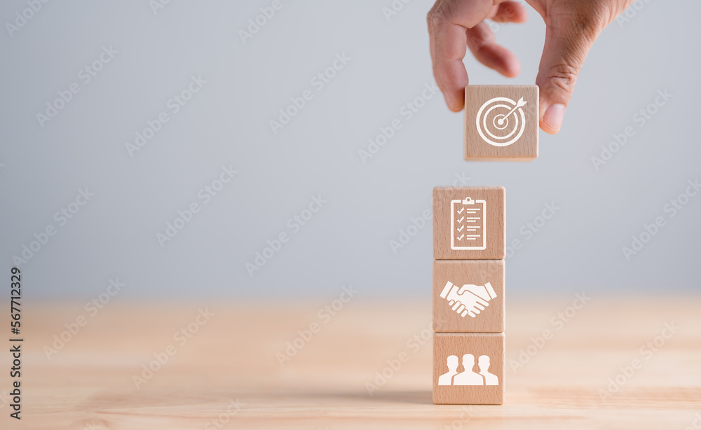 Business goal with growth success process for Leadership concept. wooden cube blocks as a stair step with target and strategy icons on white background, vertical style. Concept success and goals. Business goal with growth success process for Leadership concept. wooden cube blocks as a stair step with target and strategy icons on white background, vertical style. Concept success and goals.