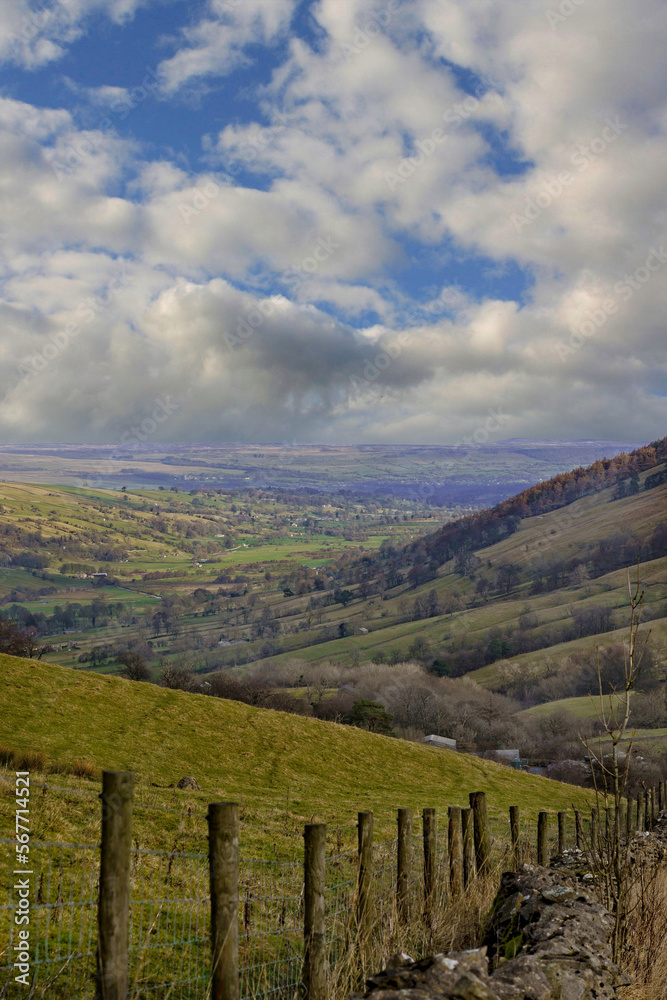 In Nidderdale, England, UK, steep, rolling hills lead to a valley that is enlightened by the morning sun, as it is located in the heart of the Yorkshire Dales.