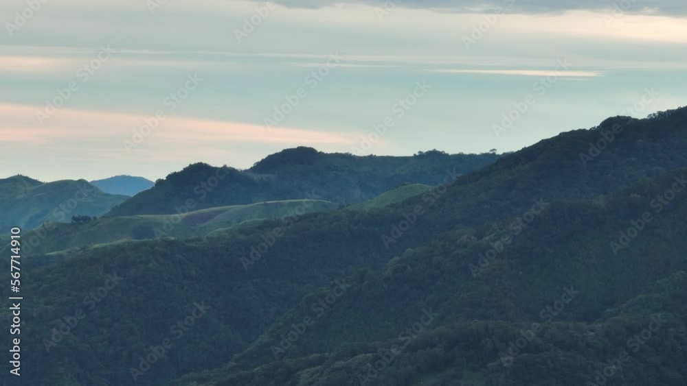 Aerial view of mountains and green hills at sunset. Negros, Philippines Aerial view of mountains and green hills at sunset. Negros, Philippines