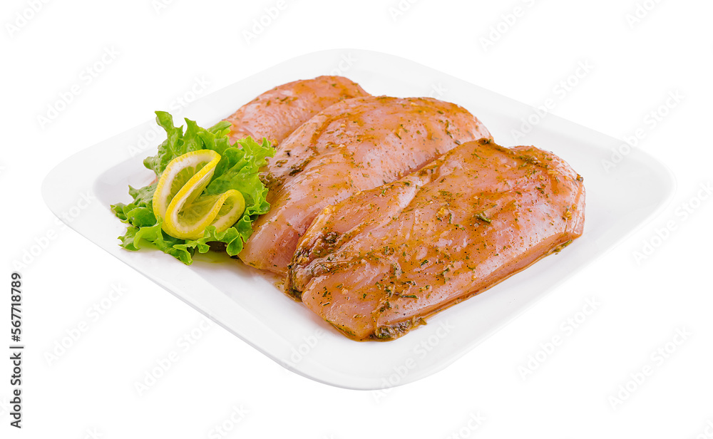 Raw marinated chicken fillet on plate Raw marinated chicken fillet on plate