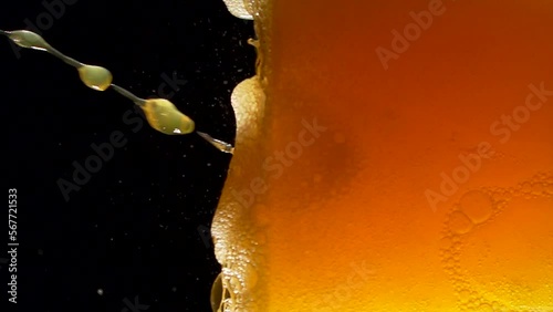 Super slow motion of clean glass with soda mineral water bubbles texture filled with fanta drink. Filmed on high speed cinema camera, 4k 1000 fps