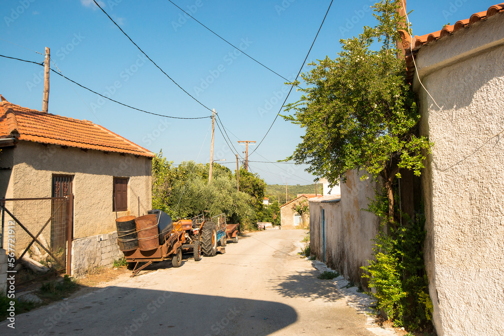 View on a road in Messini, Peloponnese, South Greece, with a tractor View on a road in Messini, Peloponnese, South Greece, with a tractor