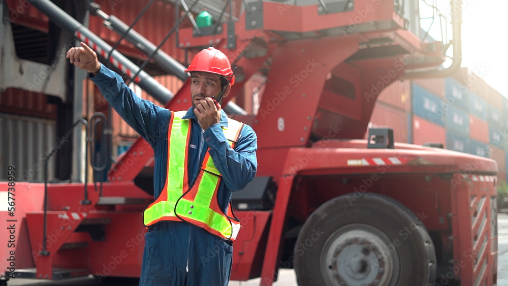 Maintenance engineer communicate to manage container and truck in container logistic area.