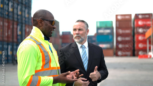 Manager and staff survey load container for shipping plan in Logistic container area company.