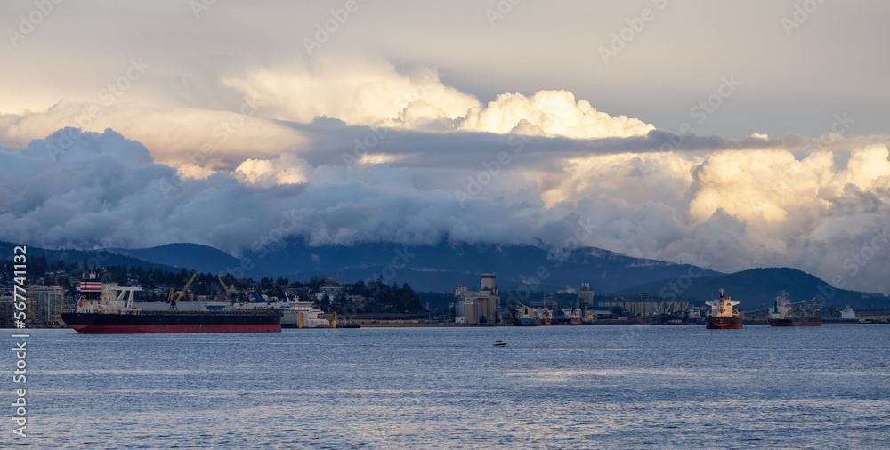 Vancouver Harbour during dramatic Cloudy Winter Sunset. Taken from Stanley Park, Downtown Vancouver, British Columbia, Canada.