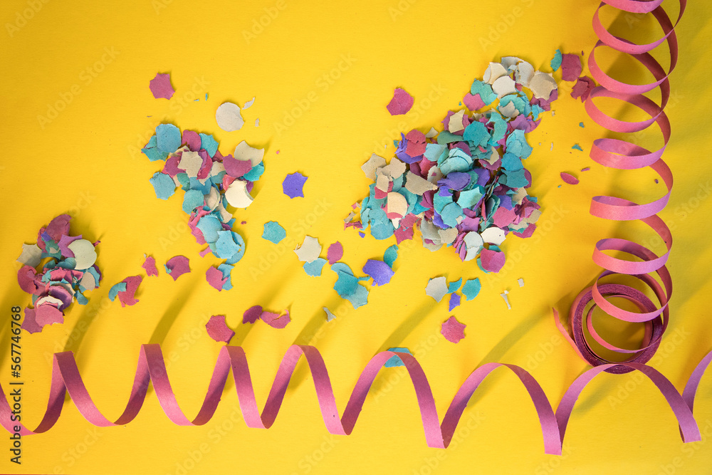 Symbolic image alluding to Carnival using streamers and confetti transmitting a lot of color typical of the festive season. Copy space.