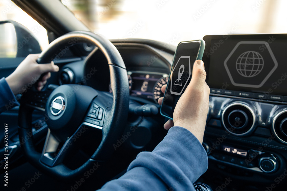 Drive using smartphone. Automotive technology concept. Infotainment, navigation communication device