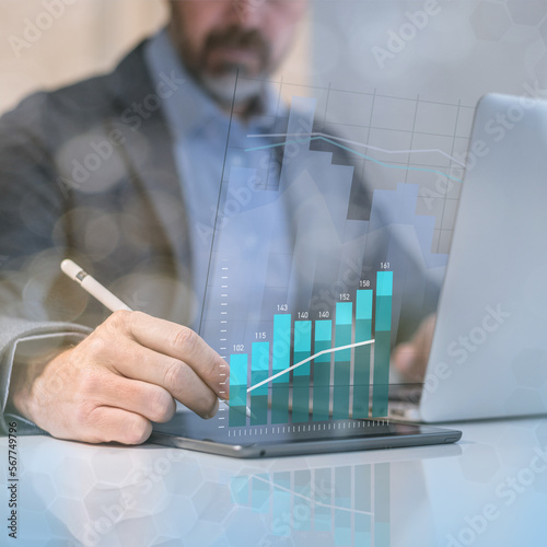 Businessman analysing budget of business market. Financial performance, revenue and costs concept.