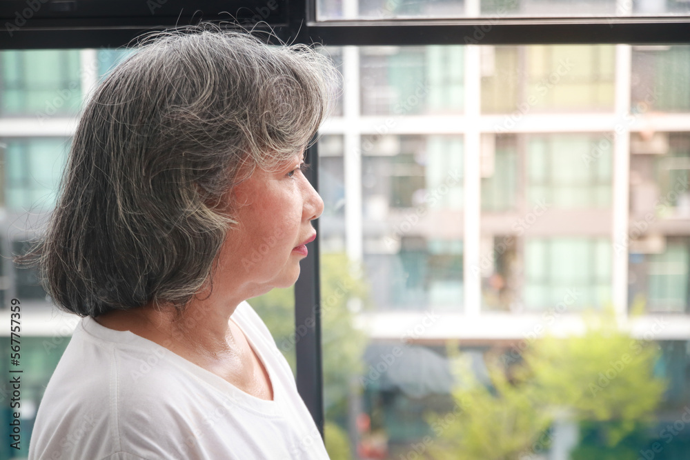 Lonely Asian elderly woman Live alone in an apartment. Living in retirement. disease of the elderly Lonely Asian elderly woman Live alone in an apartment. Living in retirement. disease of the elderly