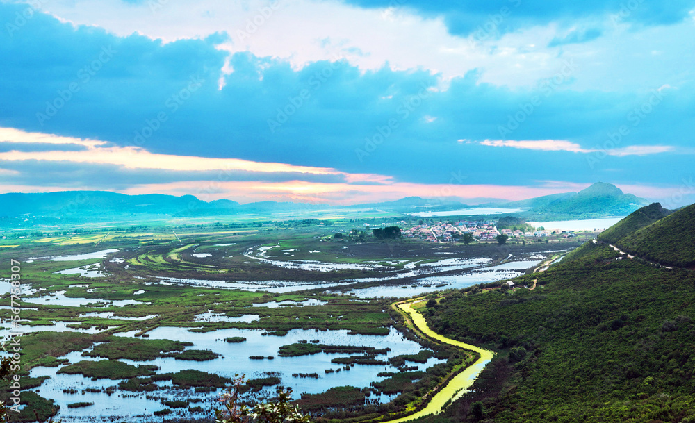 Fabulous beautiful magic dawn with small reservoirs and a yellow riveron the coast of the Ionian Sea in Greece. Amazing places.