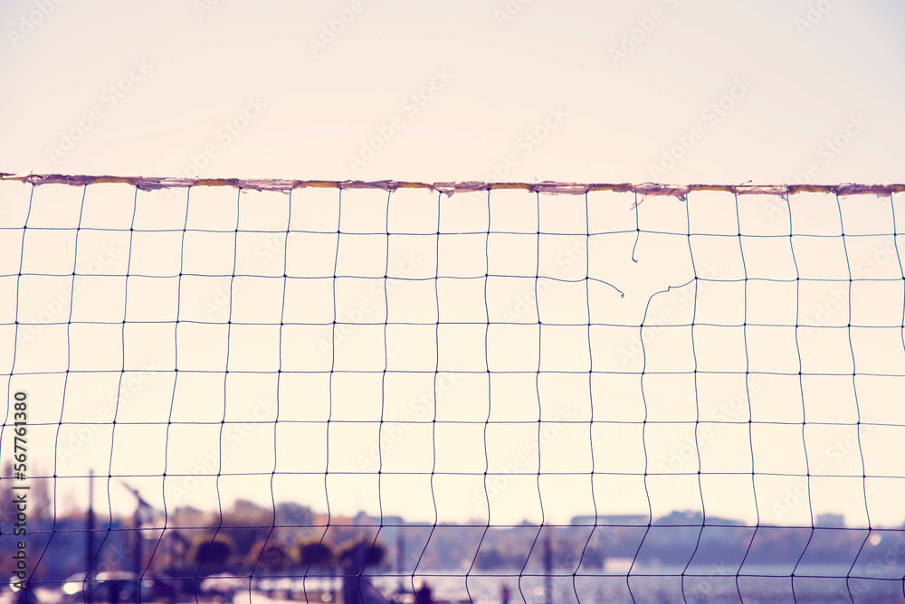 Torn volleyball net on the background of the city (failure, loss, breakdown - concept)