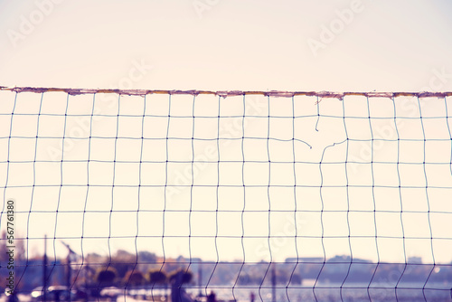 Obraz na płótnie Torn volleyball net on the background of the city (failure, loss, breakdown - concept) w salonie