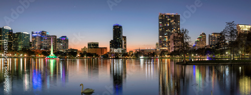 Orlando city skyline at dusk. Panoramic view of Orlando in Lake Eola Park, Florida, USA photo